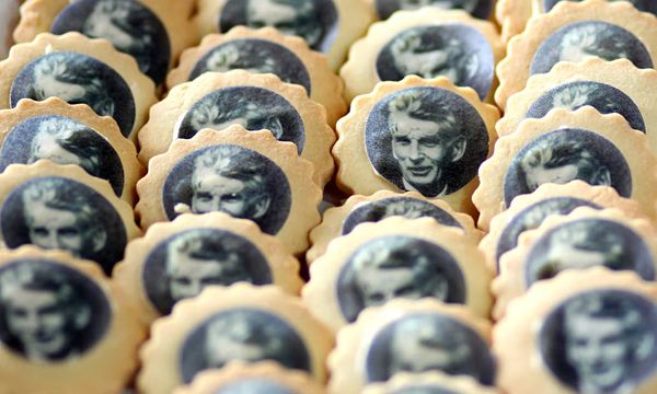 Dozens of round biscuits decorated with portraits of Samuel Beckett printed on edible paper